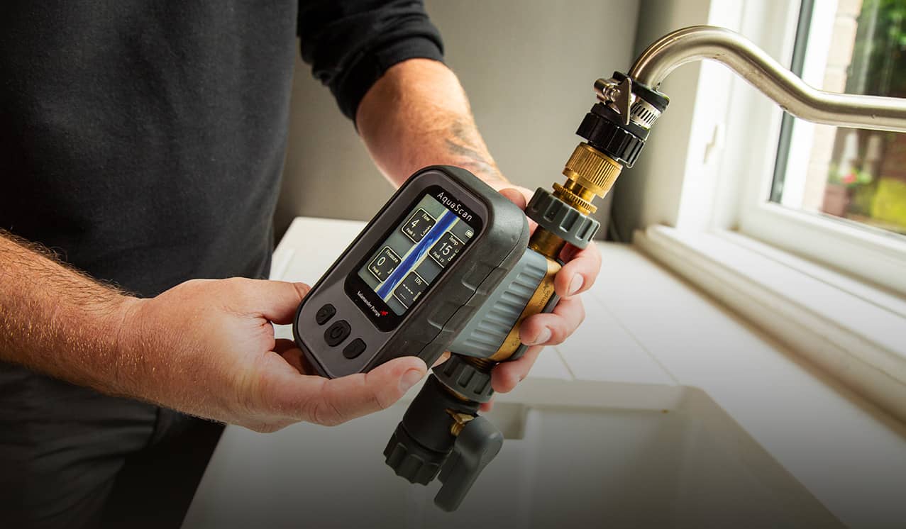 Plumber measuring water flow.