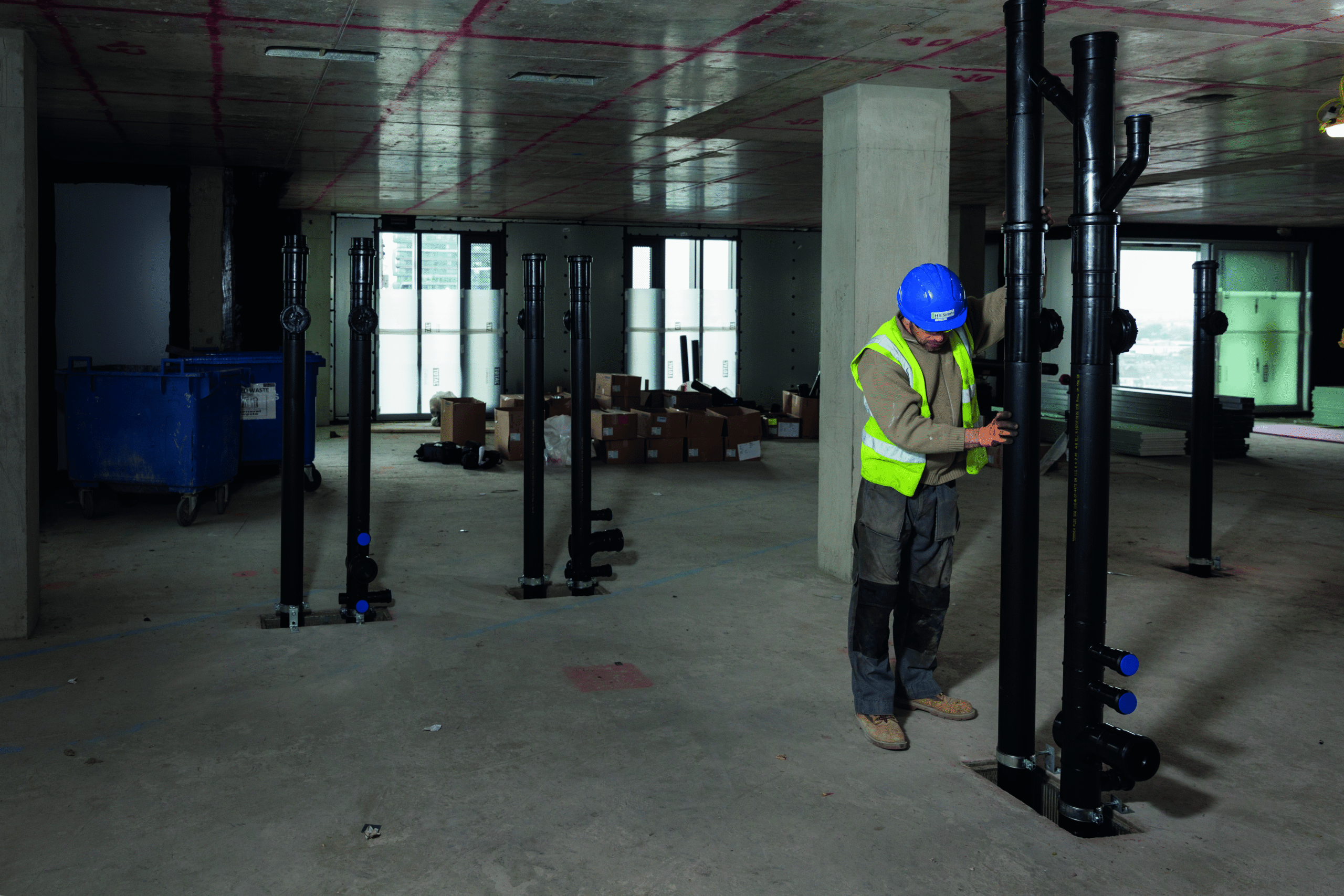 Engineer fixing pipes